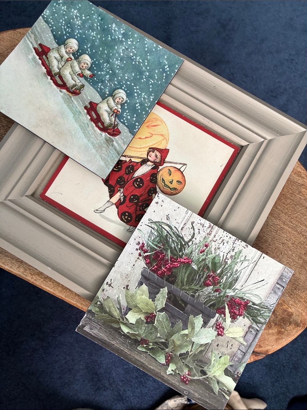 Frame with changeable art—winter, Halloween moon pumpkin, kids sledding in snow